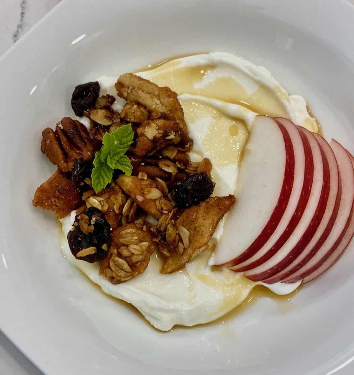 Pie crust granola with yogurt and apples.