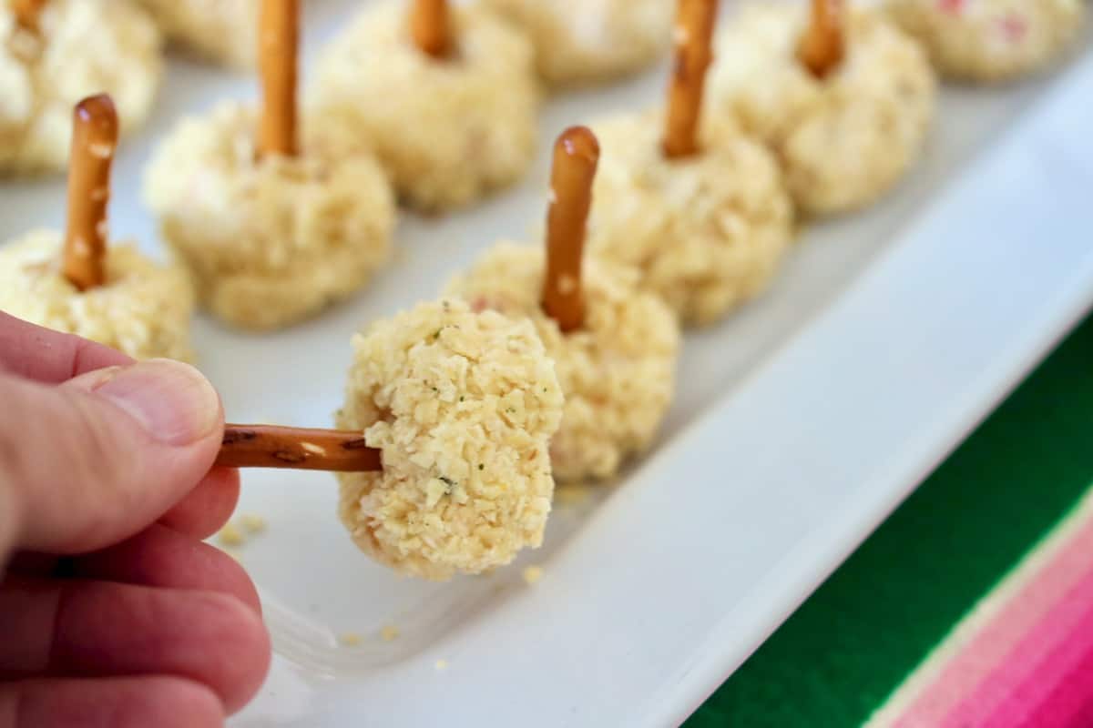 So easy to pick up a salsa cheese ball pop with a pretzel stick.