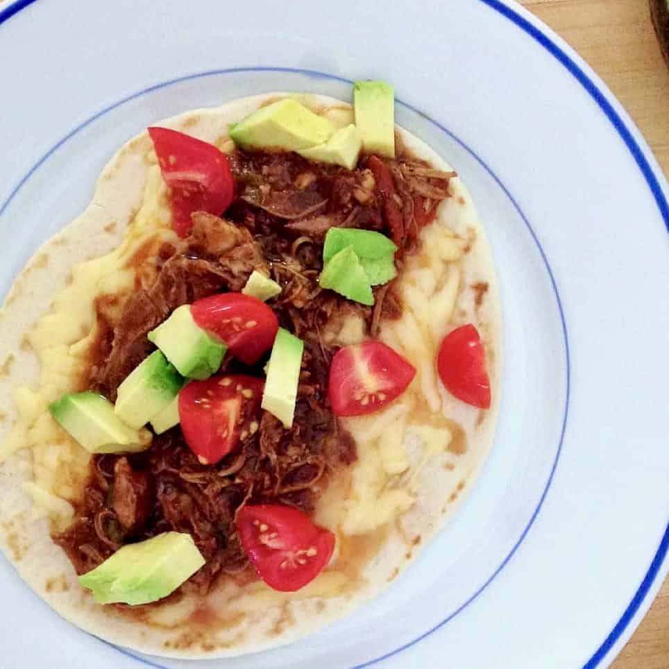 Flavorful chicken mole tortilla.