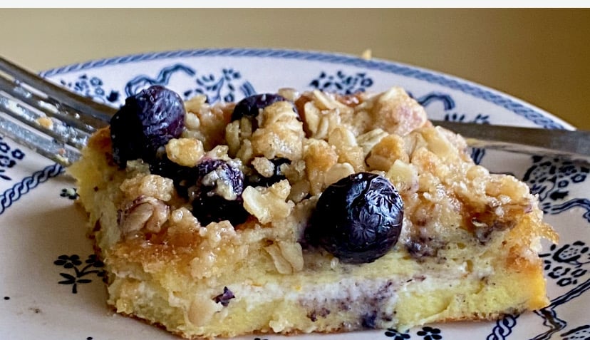 A slice of easy blueberry crumble cannoli French toast.