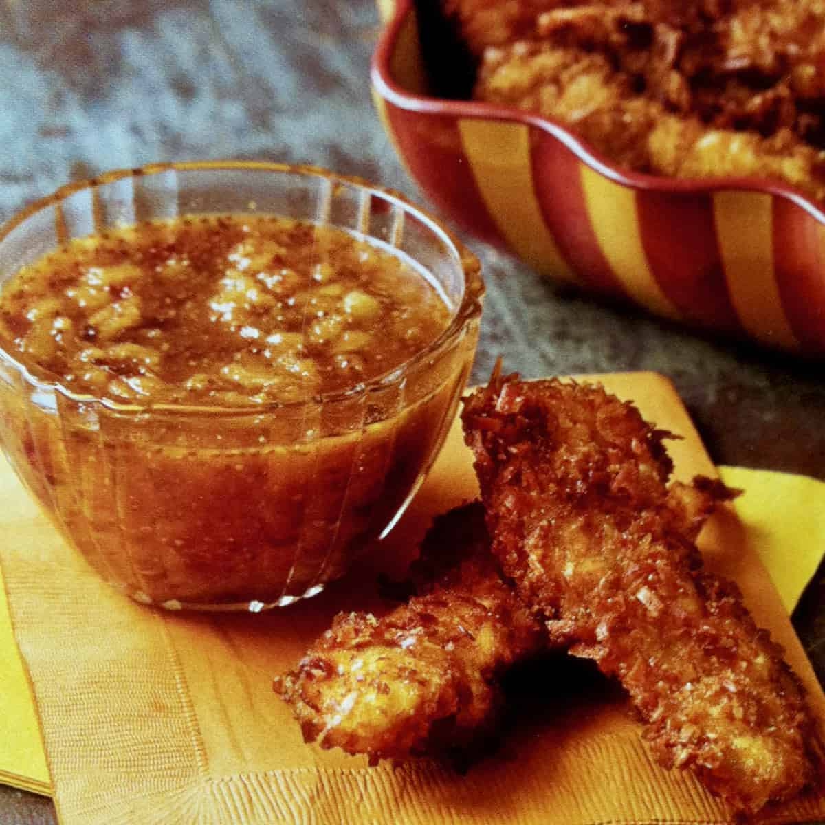 Crispy coconut chicken dippers with dipping sauce.