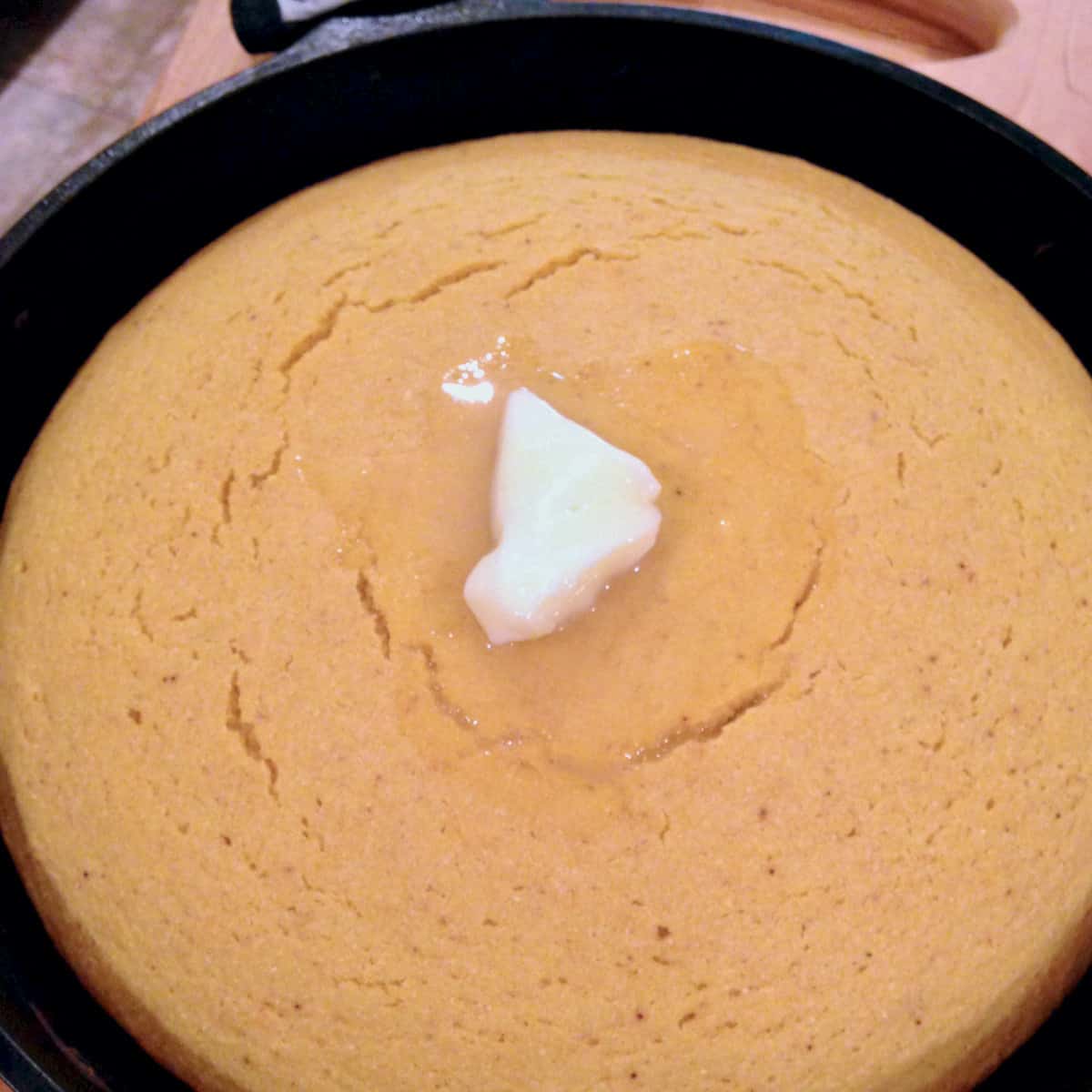 Pumpkin cornbread with butter.
