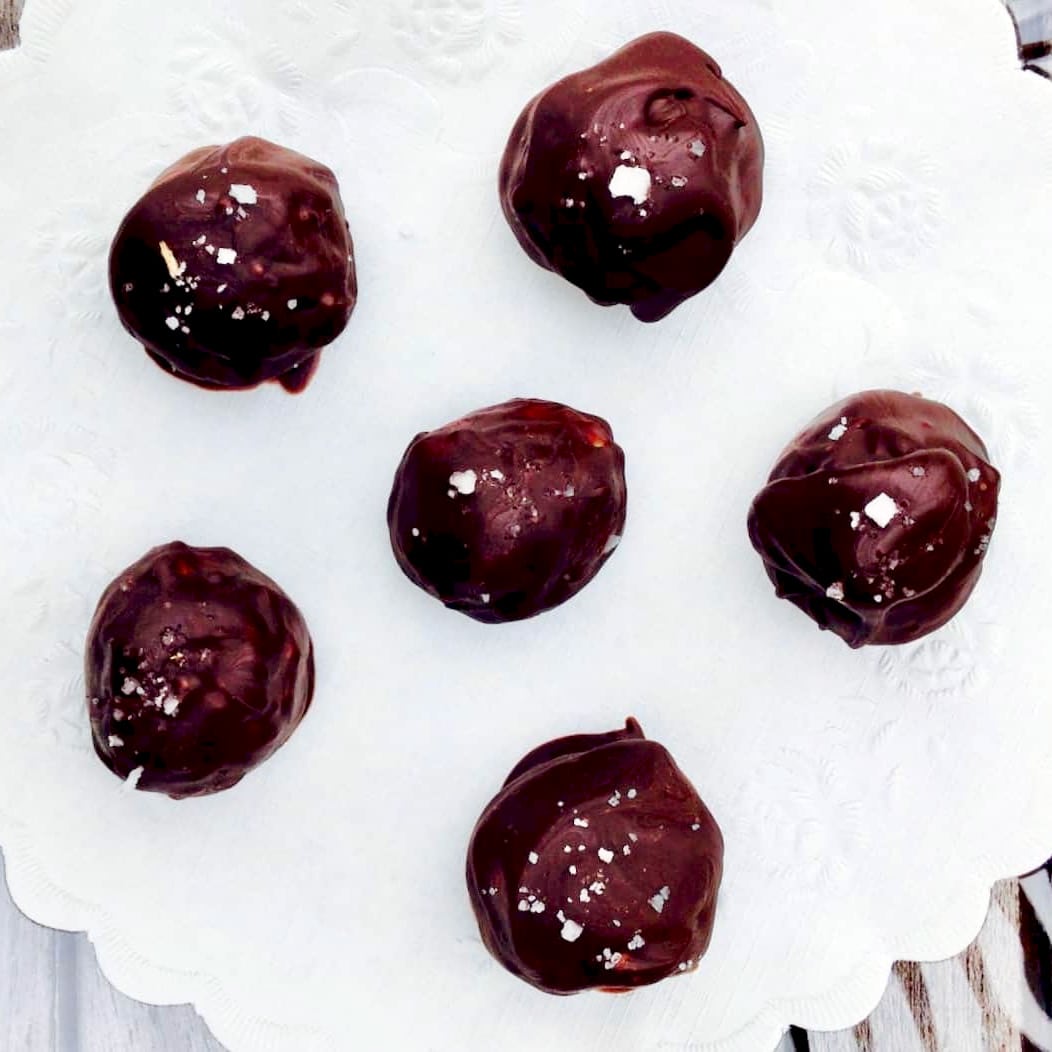 A plate of chocolate covered peanut butter bon bons.