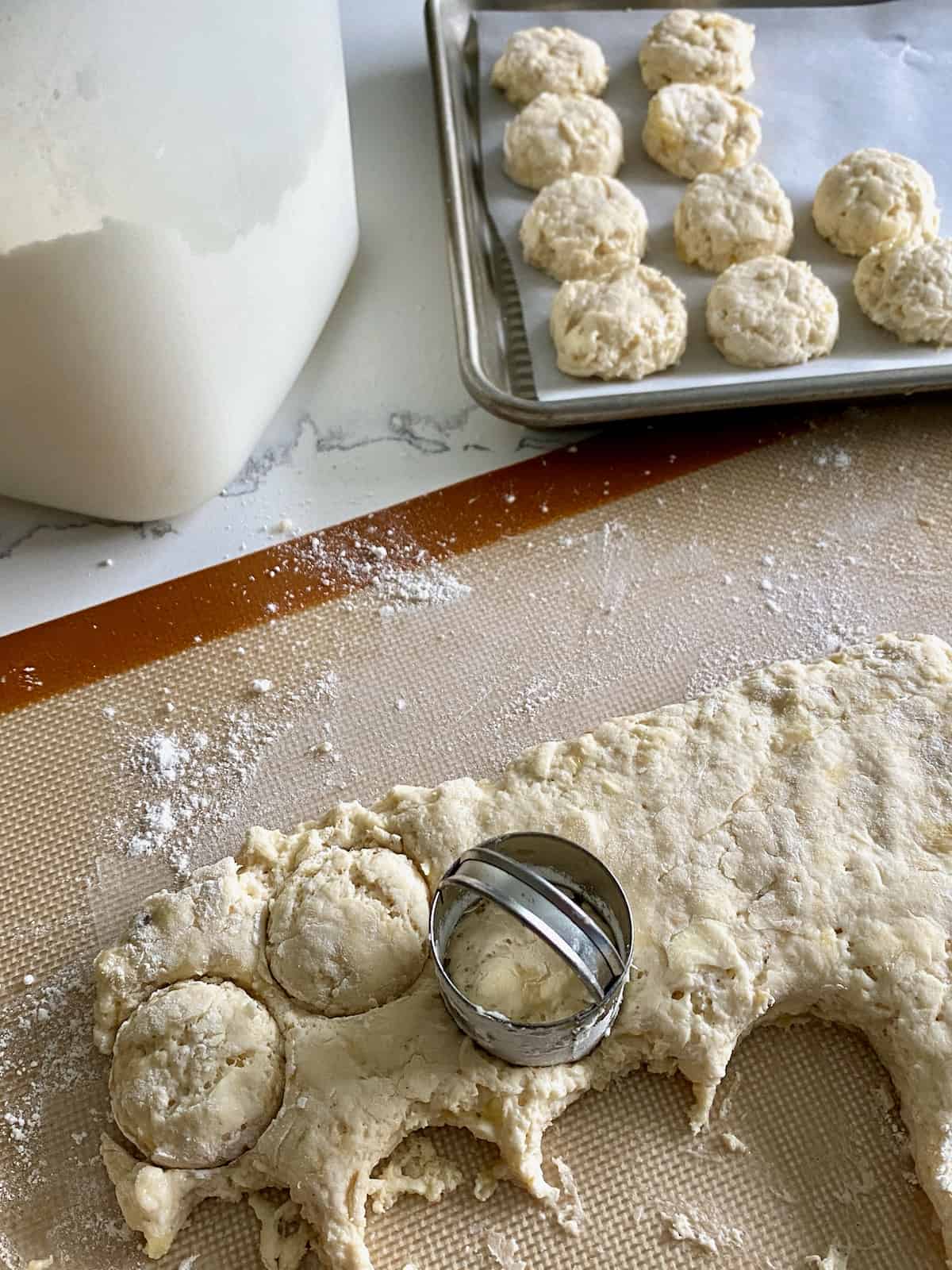 Cutting out buttermilk banana biscuit dough.