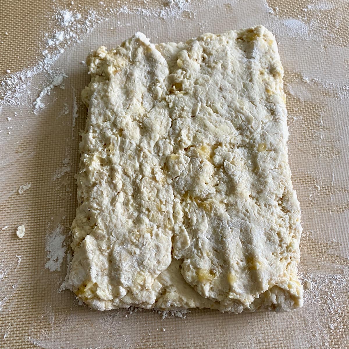 Folding the homemade biscuit dough.