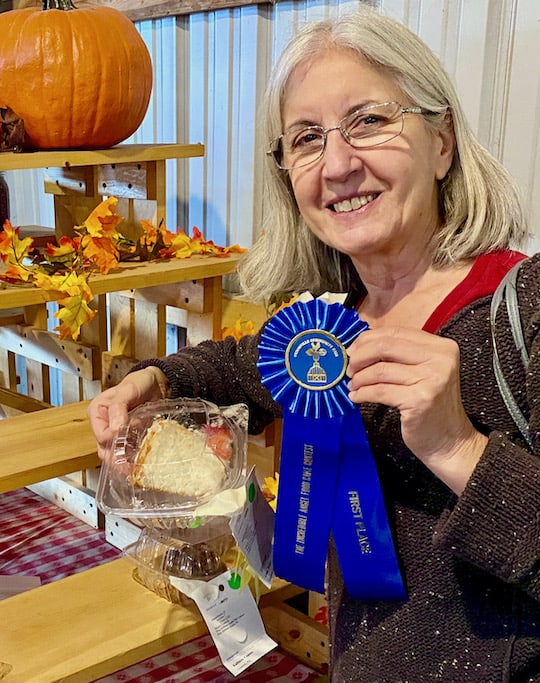 Me holding blue ribbon at the fair.