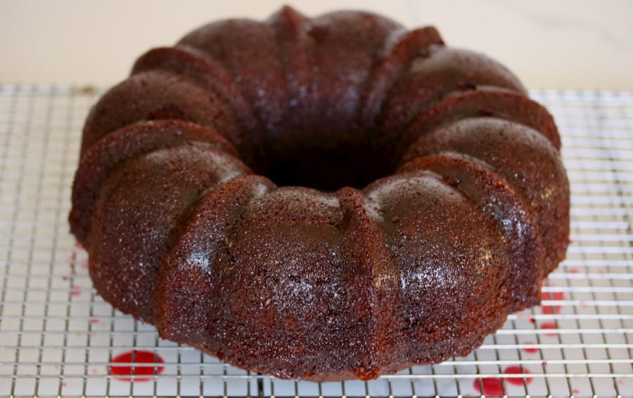 Chocolate bundt cake with raspberry syrup glaze.