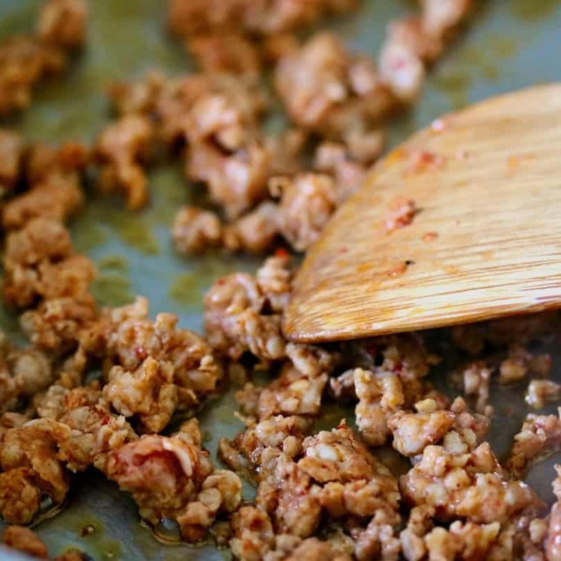 Browning Mexican chorizo in a skillet.