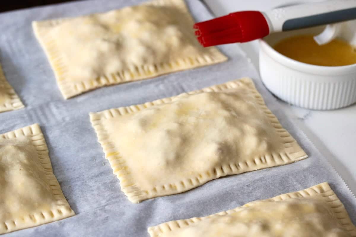 Crimped puff pastry brushed with egg wash.
