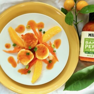 Pan seared scallops with a spicy citrus sauce.