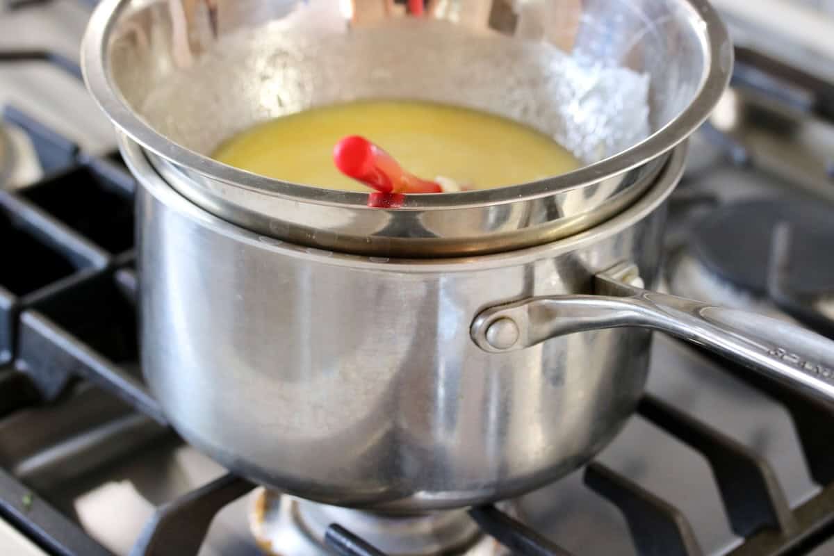 Double boiler set up with lemon filling.