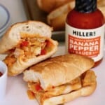 Chicken cheese steak cut in half.
