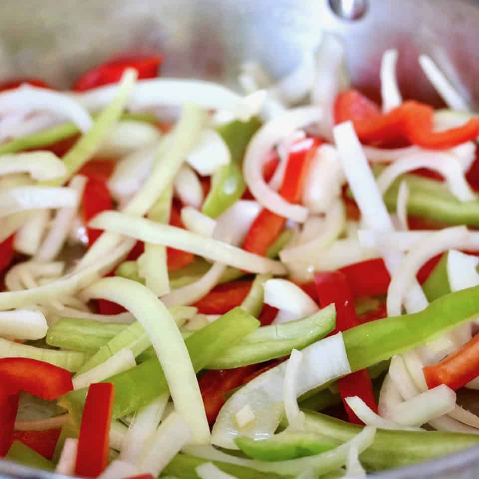 Cooking peppers and onions.