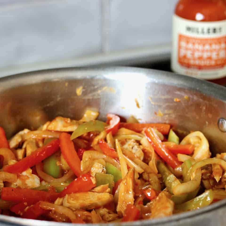 Saucy chicken, peppers and onions.
