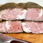 Roast beef sliced in half.
