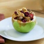 Sausage stuffed apple with cranberries.