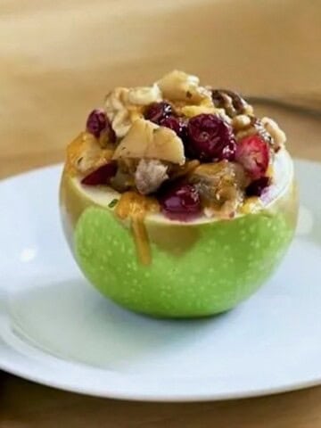 Sausage stuffed apple with cranberries.