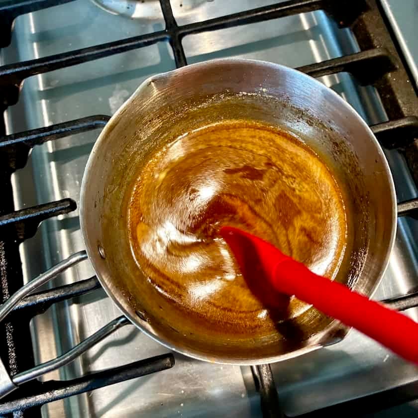 Stirring bourbon caramel.