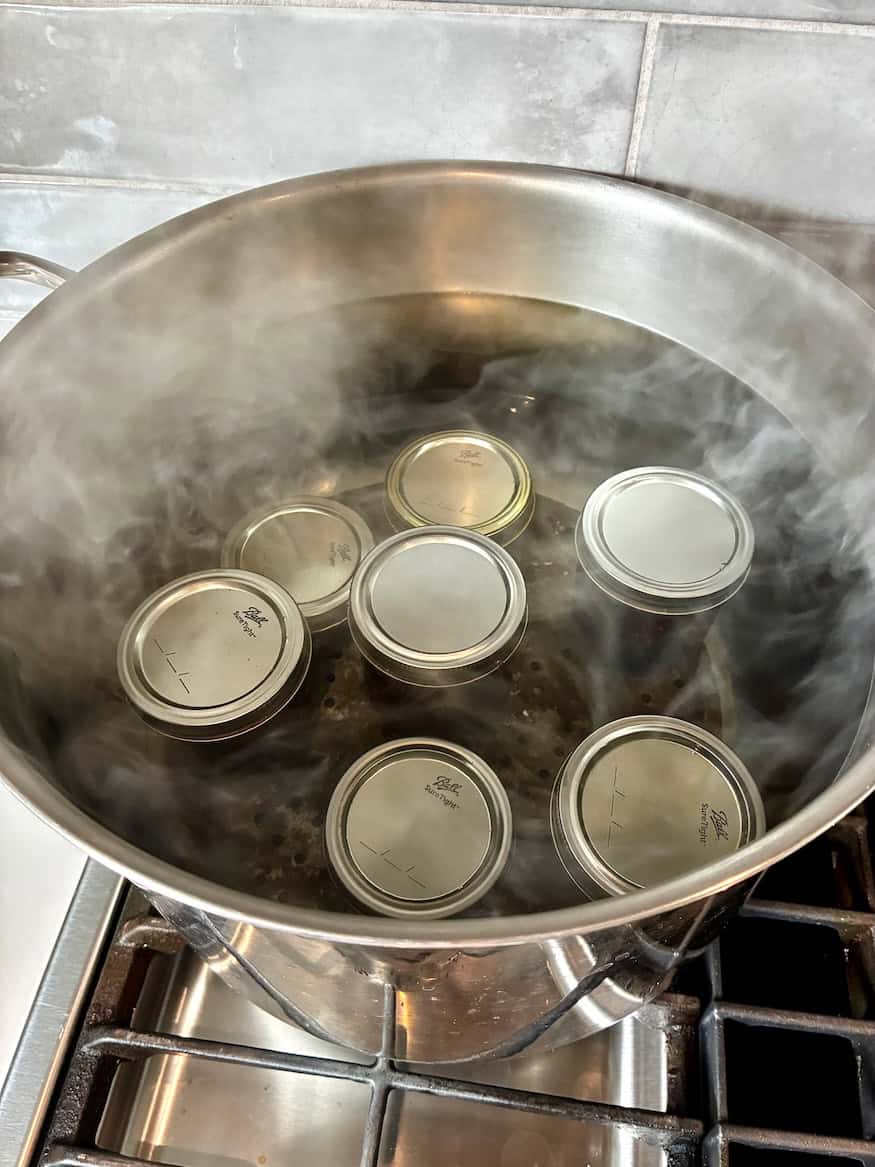 Canning water bath with jam jars.