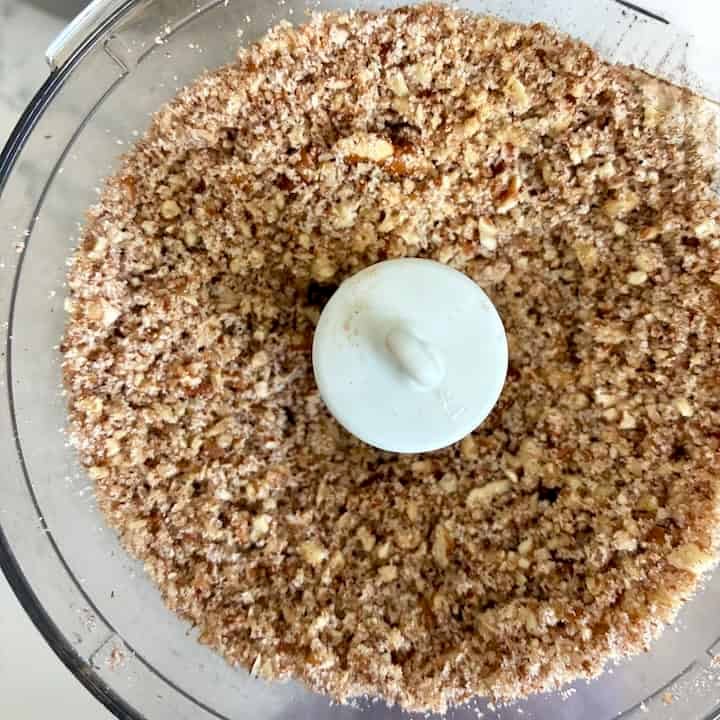 Pecan crumbs in a food processor.
