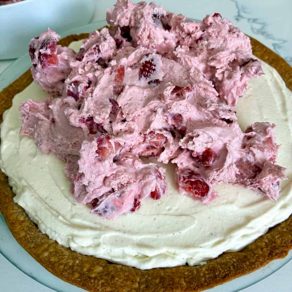 Layering filling into pie crust.