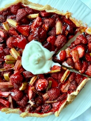 Strawberry rhubarb galette with cream.