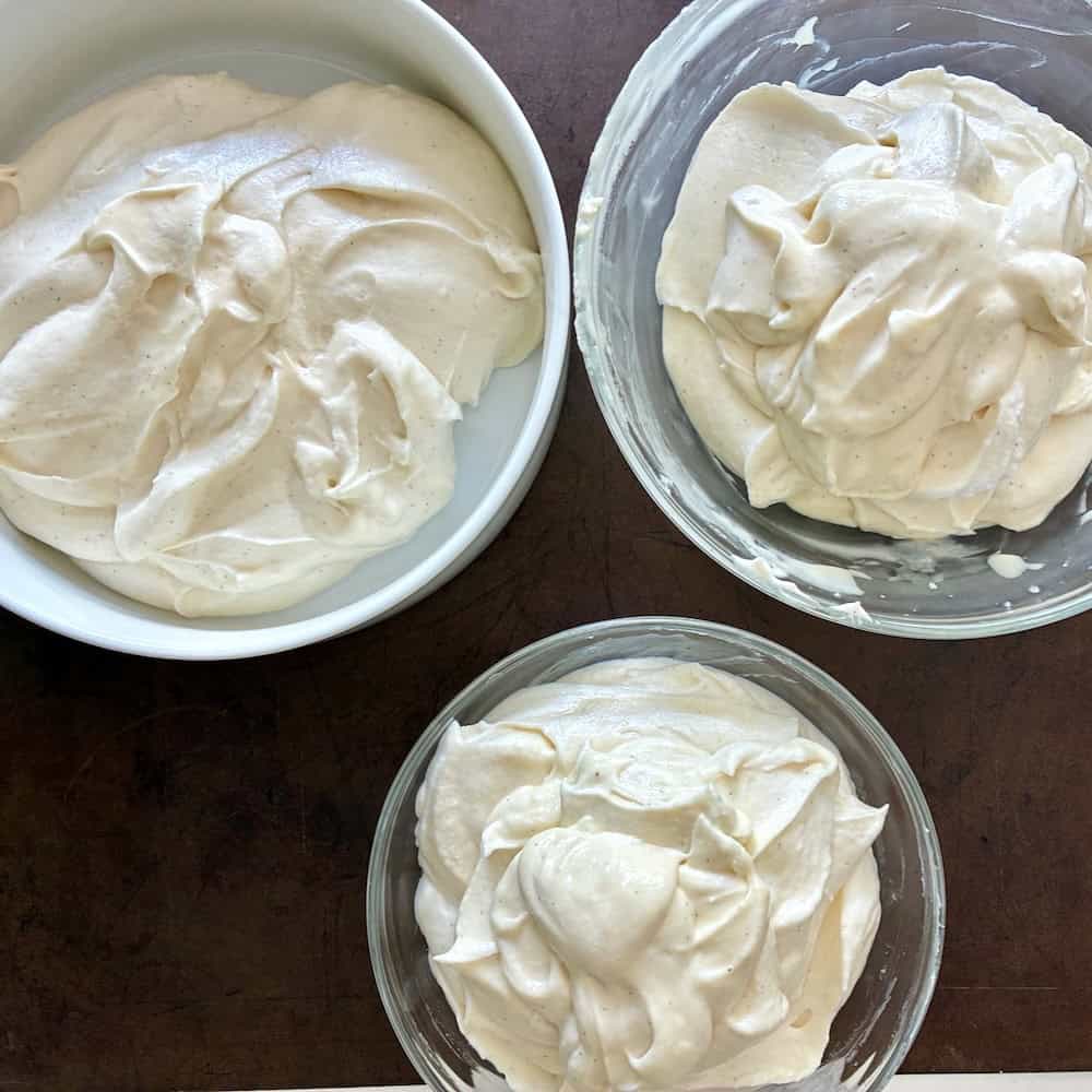 Vanilla cream cheese mousse divided into 3 bowls.