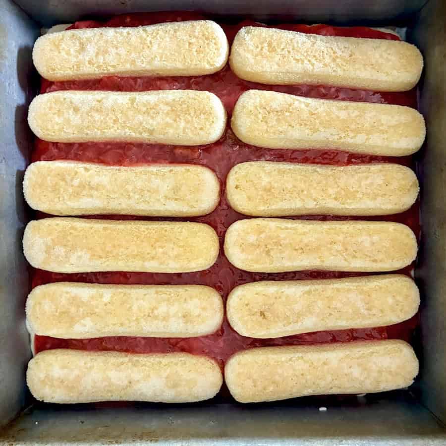 Layer of ladyfingers on jam.