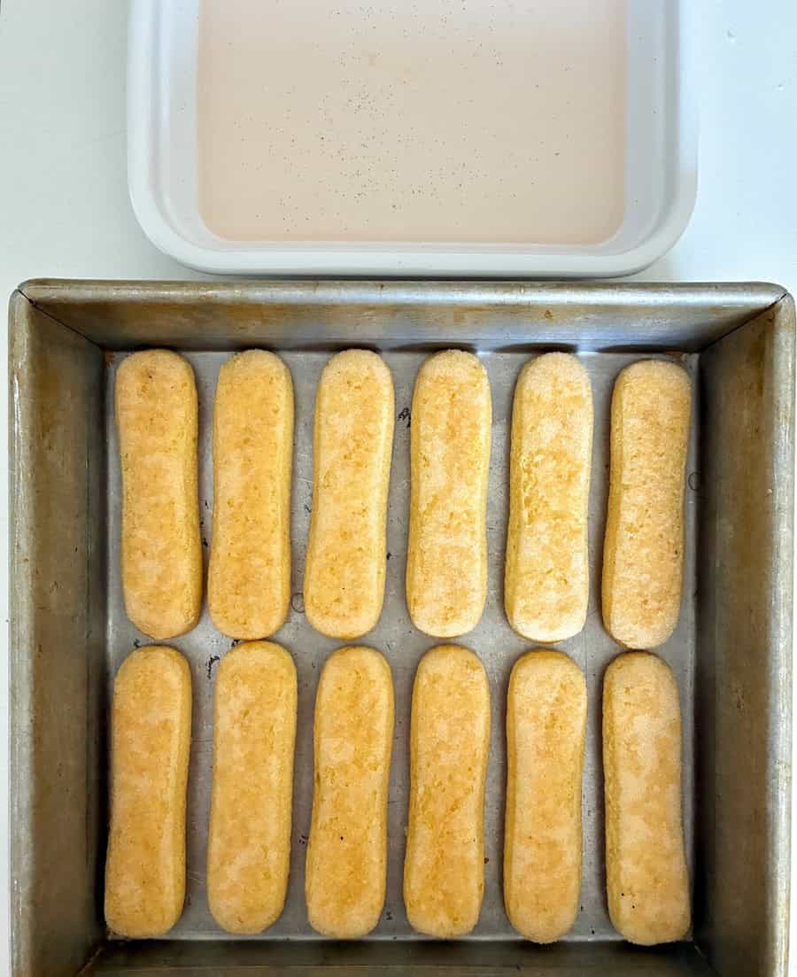 Layer of ladyfingers dipped in rhubarb syrup.