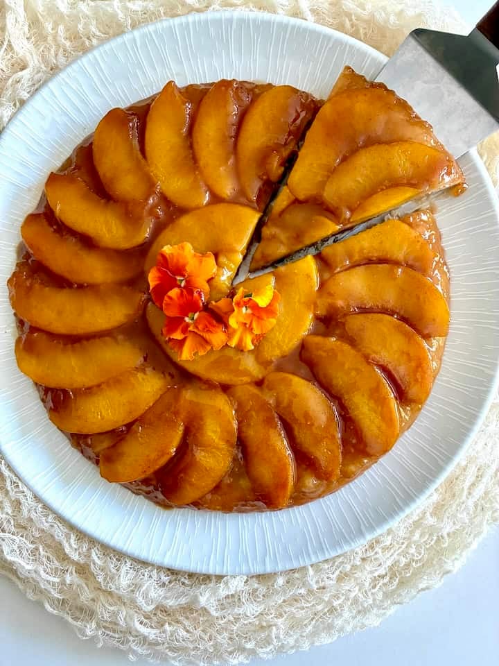 A slice of upside-down peach tart.