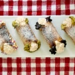 Cannoli cream pie bites on a serving tray.