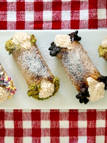Cannoli cream pie bites on a serving tray.