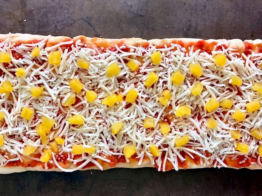 Harvest pizza with sauce, cheese and winter squash.