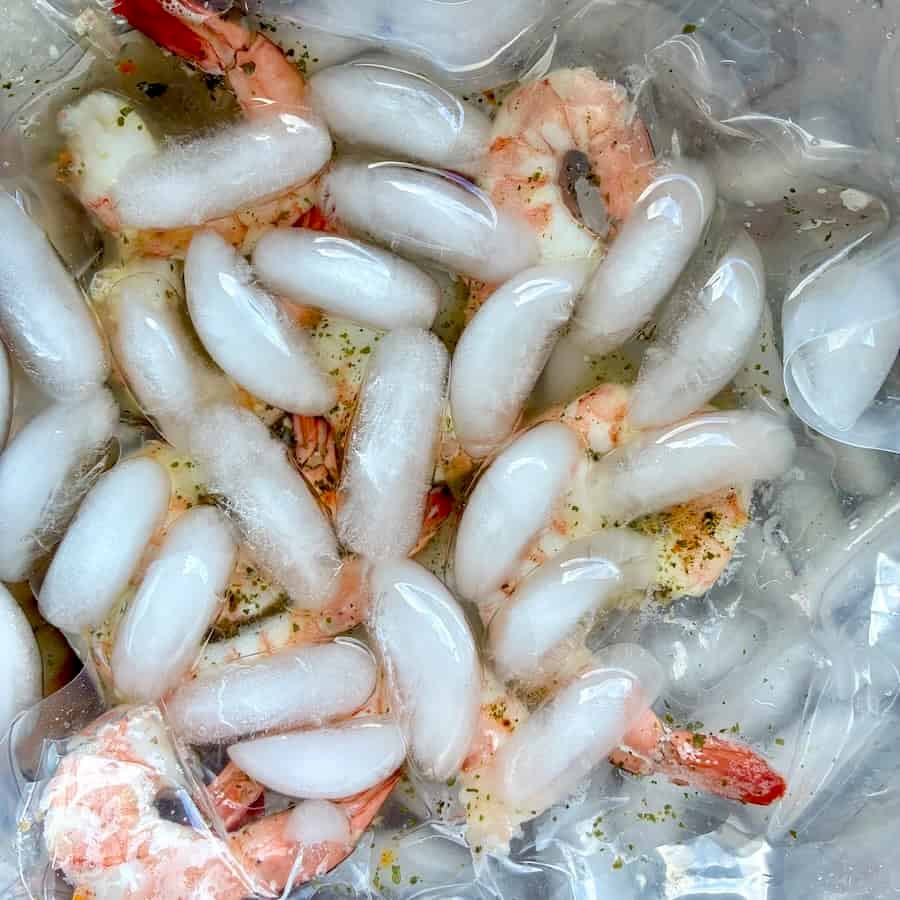 Cooling down shrimp in an ice water bath.